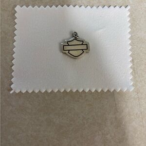 Harley-Davidson Silver Charm Pendant with polishing cloth.